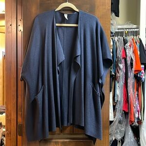 Lululemon. One size fit all. Sweater/poncho. Never been worn, perfect condition.